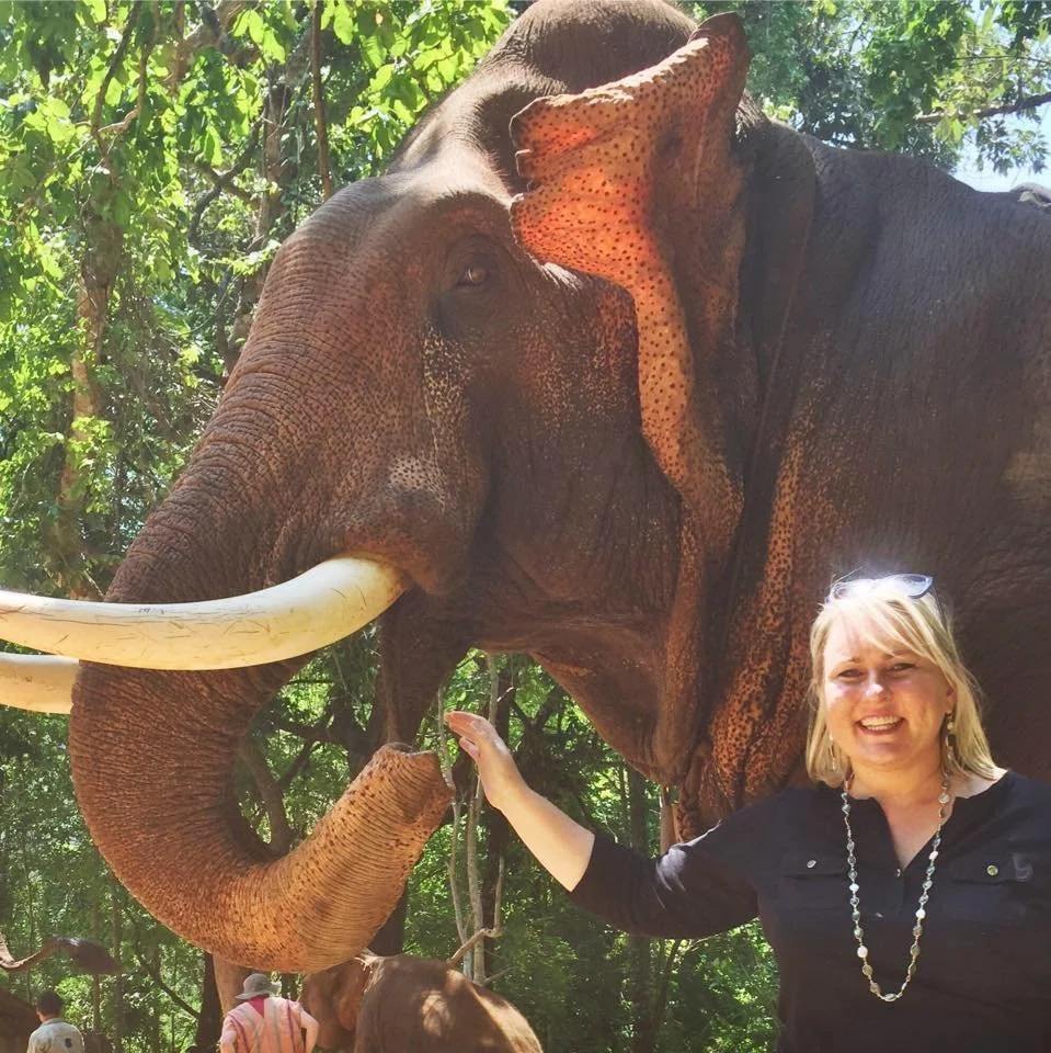 Angela with an elephant in Thailand