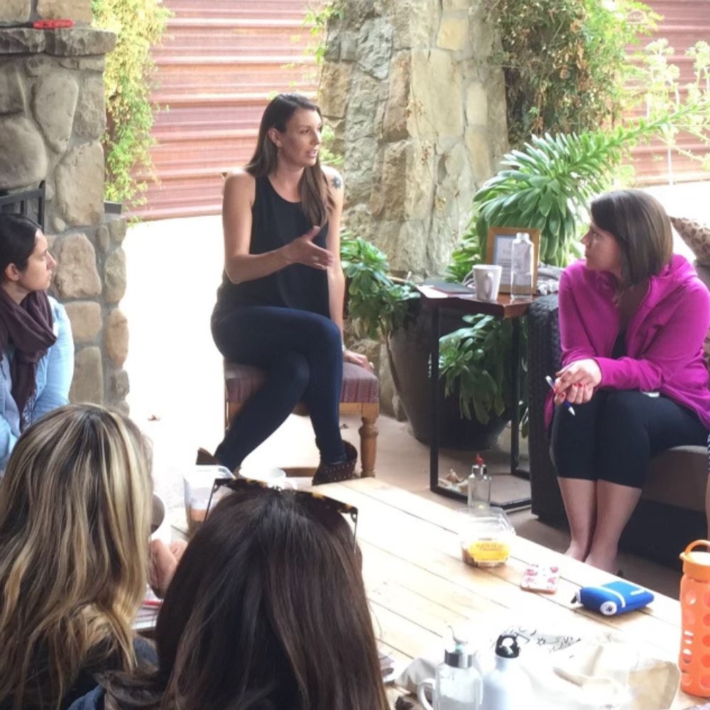 Claire Bidwell Smith leading a grief circle on the porch at a Conscious Grieving Retreat