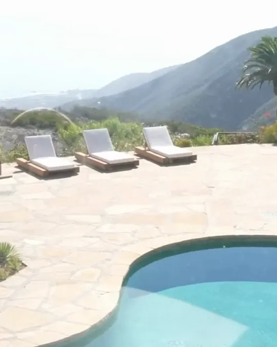 Pool deck with loungers and canyon views