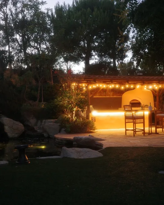 The outdoor kitchen at dusk