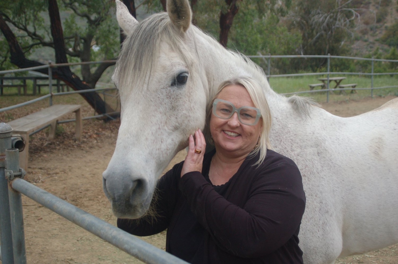 Angela with a horse at Shakti Ranch