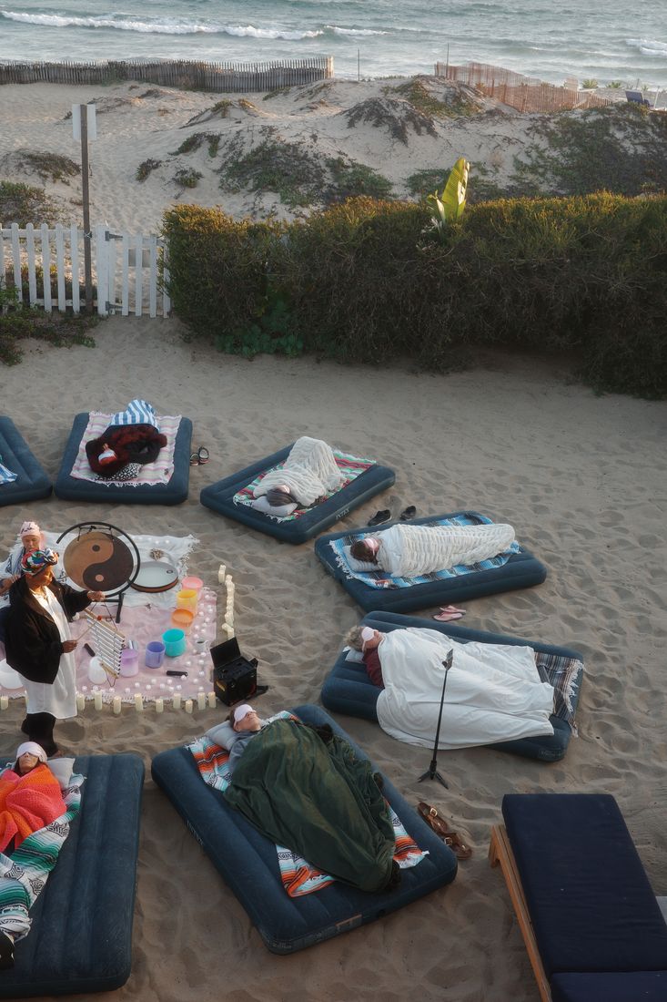 Poolside cushions and blankets arranged for an evening gathering