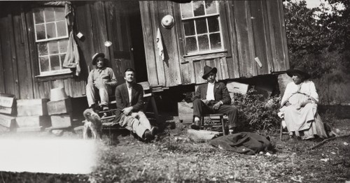 Rosario Cooper, a Northern Chumash woman, photographed with family and linguist J. P. Harrington in 1916