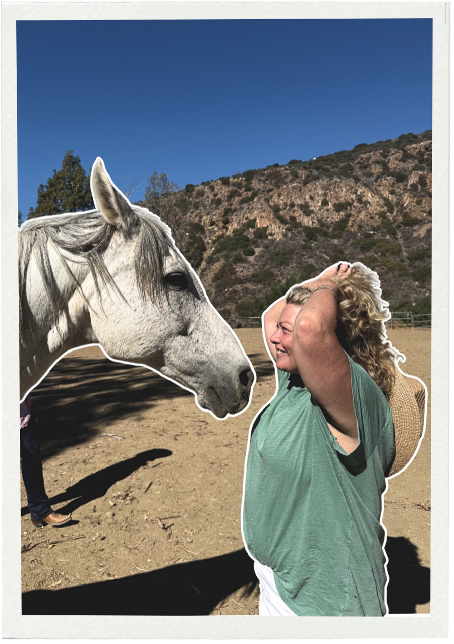 A retreat guest greeting a white horse at Shakti Ranch