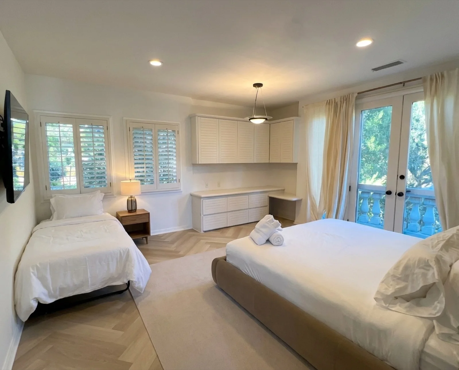 The Cloud Room: a spacious, light-filled shared bedroom with plantation shutters and a calm palette