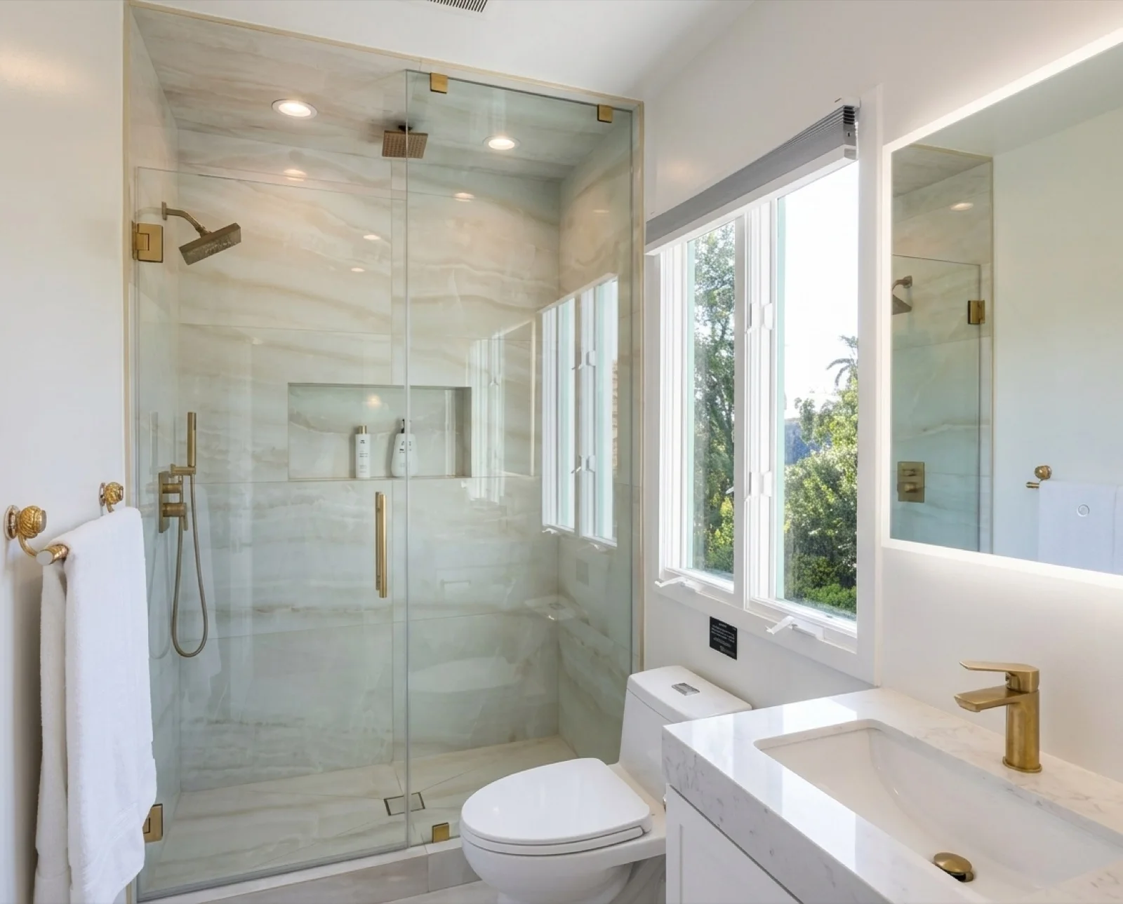 The Courtyard Room's private ensuite, with a marble steam shower and a garden window