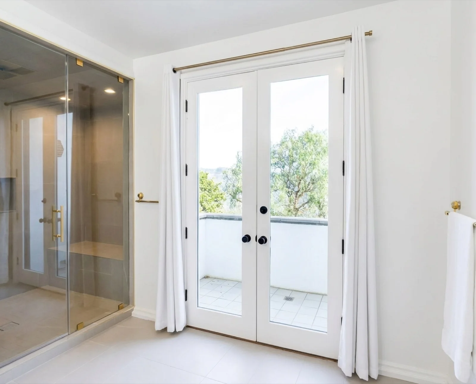Ensuite bath two opening to a private balcony