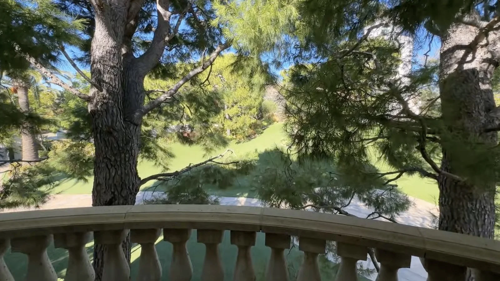 The Terrace Room's balcony, looking out into the pines and gardens