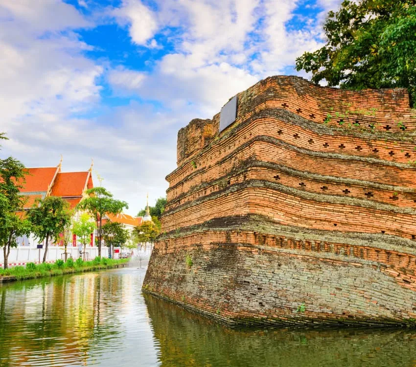 The ancient brick corner of the old city wall above the moat
